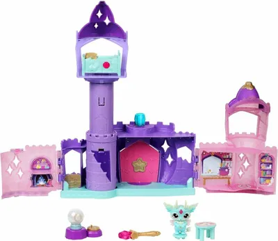 A toy castle playset with accessories and a small creature.