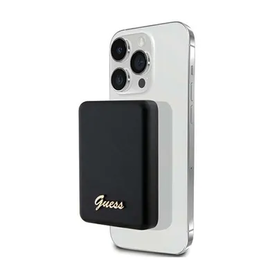 A black power bank with a gold 'Guess' logo is attached to the back of a silver iPhone.