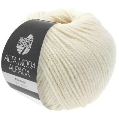 A ball of cream-colored yarn with a black label.