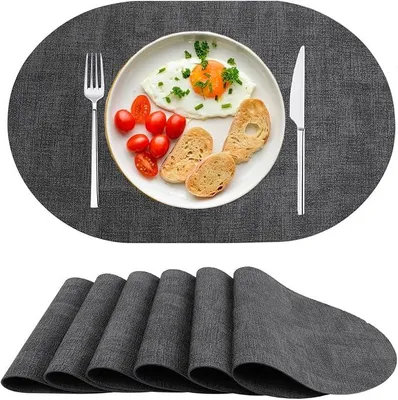 Produktbild von PolkaHome® Platzsets aus Kunstleder, 6er Set, waschbar, hitzebeständig, rutschfest, oval, schwarz
