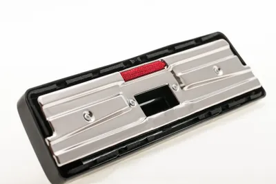 A close-up studio shot of a vacuum cleaner floor brush.
