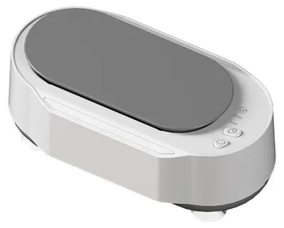 A white and gray ultrasonic cleaner for glasses.