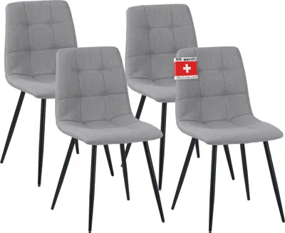 Four gray dining chairs with black legs are arranged in a group against a white background. One chair has a small red and white tag attached to its back.