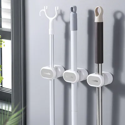 Produktbild von Universeller Werkzeughalter - Wandmontierter Besenhalter - Griffhalter für Besen, Mopp und Werkzeuge - Selbstklebend, 1 Stück [BW2027]