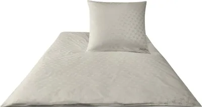 A beige duvet cover and pillowcase set with a subtle geometric pattern, laid out on a white background.