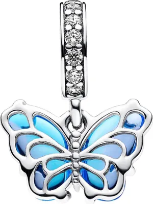 A close-up studio shot of a silver and blue butterfly charm with cubic zirconia stones on the bail.