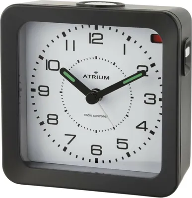A black alarm clock with a white face is shown against a white background.