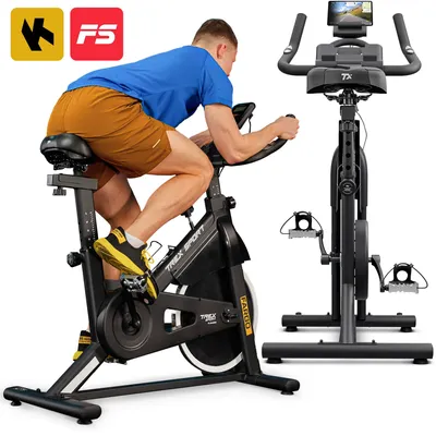 A man is riding an indoor exercise bike, with another identical bike visible in the background.