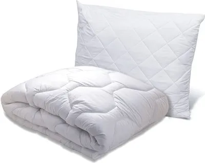 A white quilted pillow and a folded white quilted comforter are shown against a white background.