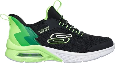 A side view of a single black and green Skechers shoe.