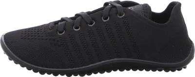 A side view of a black athletic shoe.