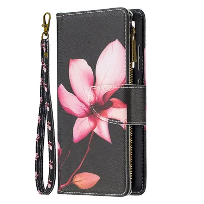 A black phone case with a pink floral design and a wrist strap.