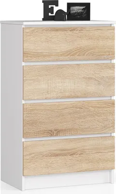 A white and wood-grain chest of drawers with decorative items on top.