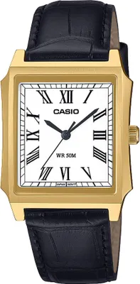 A close-up studio shot of a gold-toned Casio watch with a black leather strap.
