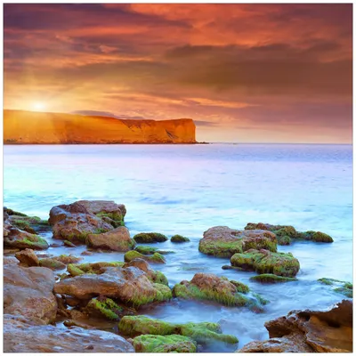 Produktbild von Wallario Magnet für Kühlschrank / Geschirrspüler, magnetisch haftende Folie - 60 x 60 cm, Motiv: Sonnenaufgang am Meer mit Landzunge und Felsen im Wasser