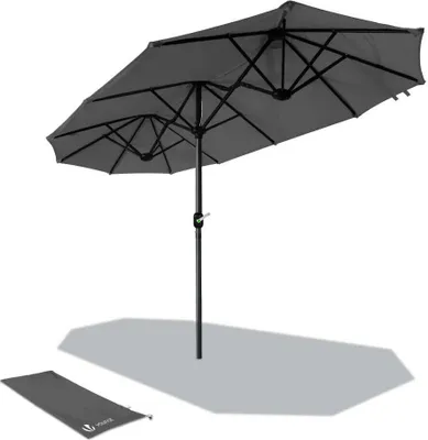 A gray double patio umbrella is shown against a white background, with a folded gray base mat in the foreground.