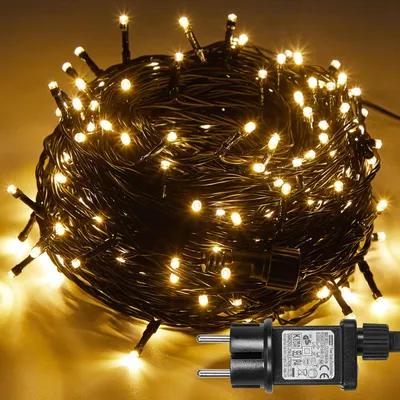 A coiled string of warm white LED lights with a power plug.