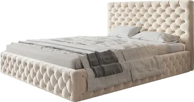 A tufted beige upholstered bed with a headboard and footboard, shown with bedding.