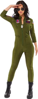 A woman in a green jumpsuit and black boots salutes.