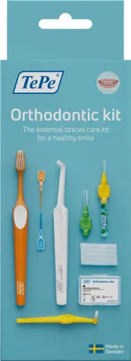 A product shot of an orthodontic care kit on a light blue background.
