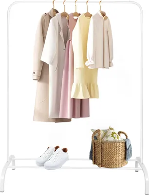 A white garment rack displaying several clothing items and accessories.