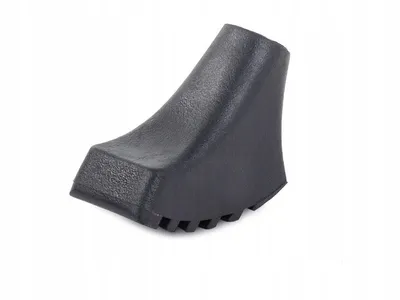 A black trekking pole tip on a white background.