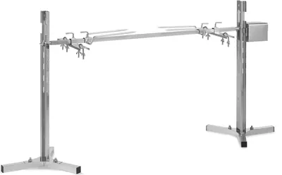 A stainless steel rotisserie grill with a motor, shown against a white background.