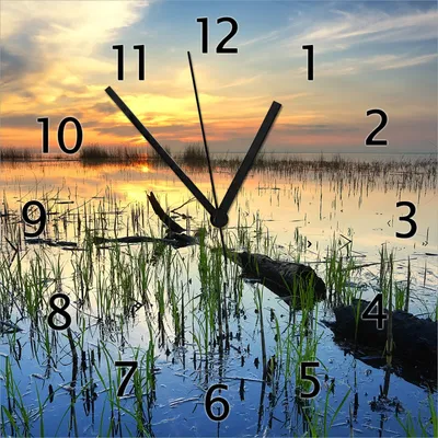 Produktbild von Wallario Design Wanduhr Schilf am Abend - Sonnenuntergang über der Seelandschaft aus Echtglas, Größe 30 x 30 cm