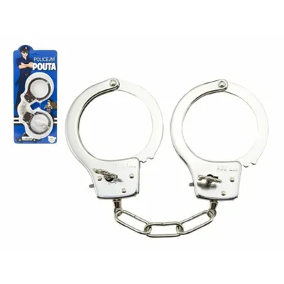 A pair of metal handcuffs on a white background, with their packaging to the left.