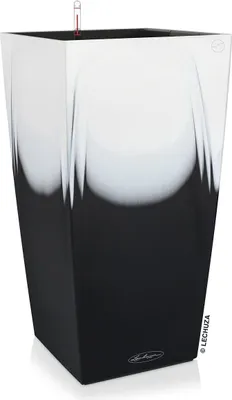 A tall, square planter with a black and white gradient design.