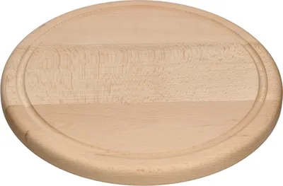 A round wooden cutting board with a groove around the edge.
