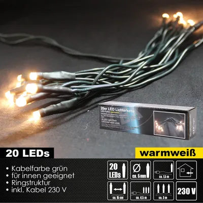 A close-up of a string of warm white LED lights with a product box in the background.
