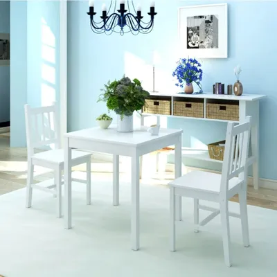 A dining set in a light blue room.