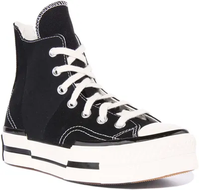 A studio shot of a black high-top Converse Chuck 70 Plus sneaker with white laces and a thick white sole.