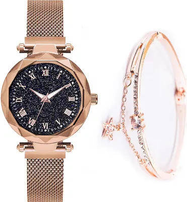 A rose gold watch with a black, starry dial and a matching bracelet are displayed against a white background.