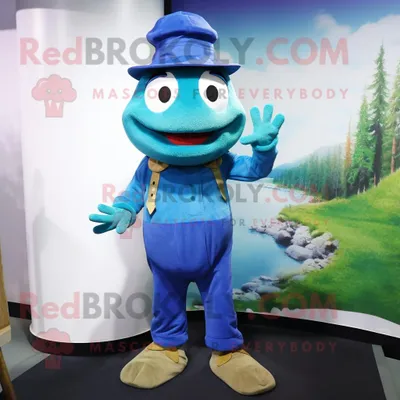 Obrázek produktu pro Postava REDBROKOLY maskota modré žáby oblečená v manšestrových kalhotách a čepicích