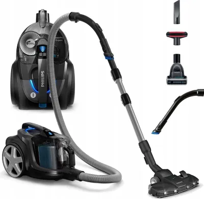 A product shot of a Philips vacuum cleaner with its accessories.