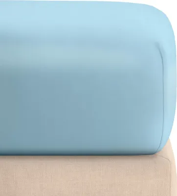 A close-up view of a light blue fitted sheet folded over a beige surface.