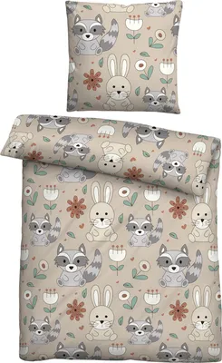 A flat lay of a duvet cover and pillowcase set with a cute animal and floral pattern.
