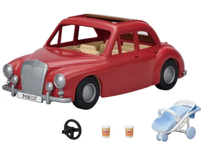 A red toy car with accessories on a white background.