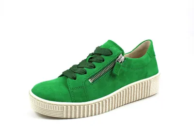 A single green sneaker is shown against a white background.