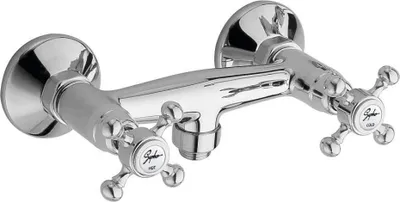 A chrome-plated bathroom faucet with two cross-shaped handles.