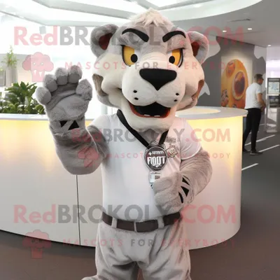 Obrázek produktu pro Postava REDBROKOLY maskota šedého šavlozubého tygra oblečená do popelínové košile a náušnic