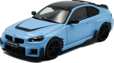 A blue and black BMW M2 G87 model car.