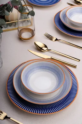 A table setting with dinnerware and cutlery.