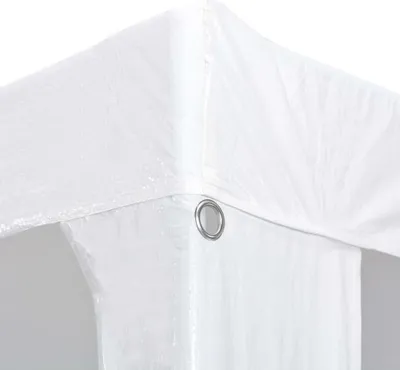 Close-up of the corner of a white tent or canopy, showing a metal grommet.