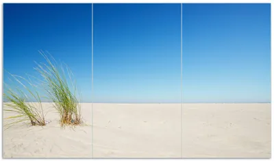 Produktbild von Wallario Herdabdeckplatte aus Glas, Größe 90 x 52 cm 3-teilig, Motiv Sandstrand unter blauem Himmel