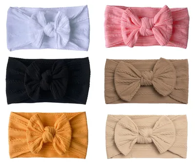 Immagine prodotto di 6 fasce per capelli con fiocco per neonate, realizzate in nylon morbido, adatte a bambine da 0 a 6 mesi