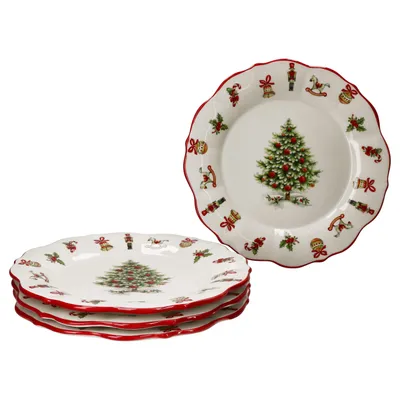 A stack of four Christmas-themed plates with a red scalloped edge and a Christmas tree in the center, surrounded by various Christmas ornaments and figures.