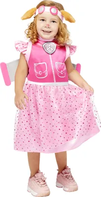 A young girl wearing a pink Skye Paw Patrol costume with wings and a headband.